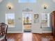 Bright foyer with hardwood floors, large windows, and an open view to the outdoors at 4465 Red Hill Cir, Denver, NC 28037