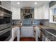 Modern kitchen featuring stainless steel appliances, white cabinets, gray countertops and tile backsplash at 4465 Red Hill Cir, Denver, NC 28037