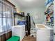 Well-organized laundry room with modern appliances, shelving, and ample storage space at 4465 Red Hill Cir, Denver, NC 28037