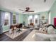 Bright office with wood floors, ceiling fan, mint walls, stylish desk, and two large windows at 4465 Red Hill Cir, Denver, NC 28037