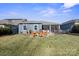 Spacious backyard with patio, seating area, and grassy lawn at 5002 Looking Glass Trl, Denver, NC 28037