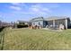 Spacious backyard with patio, fire pit and view of wooded area at 5002 Looking Glass Trl, Denver, NC 28037