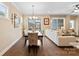 Elegant dining room with hardwood floors and a view of the backyard at 5002 Looking Glass Trl, Denver, NC 28037