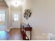 Bright entryway with hardwood floors and decorative wall art at 5002 Looking Glass Trl, Denver, NC 28037