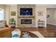 Modern electric fireplace with stone surround at 5002 Looking Glass Trl, Denver, NC 28037