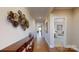 Hardwood floor hallway with access to bedrooms and living areas at 5002 Looking Glass Trl, Denver, NC 28037