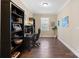 Bright home office with built-in shelving and hardwood floors at 5002 Looking Glass Trl, Denver, NC 28037