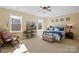 Spacious main bedroom with ample natural light and a ceiling fan at 5002 Looking Glass Trl, Denver, NC 28037