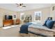 Main bedroom with dresser, seating area and large windows at 5002 Looking Glass Trl, Denver, NC 28037