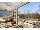 Relaxing screened porch with outdoor furniture and a view of the backyard at 5002 Looking Glass Trl, Denver, NC 28037