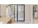 Large walk-in shower with tiled walls and built-in seat at 5002 Looking Glass Trl, Denver, NC 28037