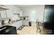 Kitchen with gray cabinets, granite countertops and a breakfast nook at 507 E Third Ave, Gastonia, NC 28054