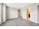 Well-lit bedroom with gray carpet and multiple entry points at 521 N Graham St # 2A, Charlotte, NC 28202