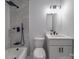 Modern bathroom with gray tile, shower, and vanity at 5224 Kildare Dr, Charlotte, NC 28215