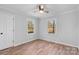 Bright bedroom with hardwood floors and two windows at 5224 Kildare Dr, Charlotte, NC 28215