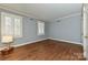 This room features hardwood floors and two windows offering plenty of natural light at 525 Pine Rd, Davidson, NC 28036