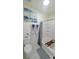 Clean bathroom with a tub, toilet, and patterned floor at 5305 Esther Ln, Charlotte, NC 28214