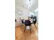 Modern dining area with a white table and four black chairs at 5305 Esther Ln, Charlotte, NC 28214