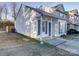 Side view of charming townhome with gray shutters and a covered porch at 5305 Esther Ln, Charlotte, NC 28214