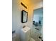 Bright bathroom with vanity and mirror, open to the nearby living area at 640 Mckee St, Albemarle, NC 28001