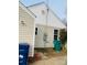 A view of the side of the home, highlighting the siding and backyard access at 640 Mckee St, Albemarle, NC 28001