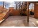 Brick patio with wooden stairs leading to a deck at 6742 Constitution Ln, Charlotte, NC 28210