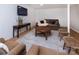 Finished basement Gathering room features comfortable seating and a large TV at 6742 Constitution Ln, Charlotte, NC 28210
