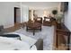 Spacious basement recreation area with ample seating and access to other rooms at 6742 Constitution Ln, Charlotte, NC 28210
