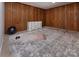 Finished basement area with wooden paneling, great for a home gym at 6742 Constitution Ln, Charlotte, NC 28210