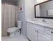 Clean bathroom with white vanity, marble countertop, and shower/tub combo at 6742 Constitution Ln, Charlotte, NC 28210