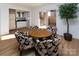 Charming dining area with a round table and unique chairs, near a kitchenette at 6742 Constitution Ln, Charlotte, NC 28210