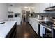 Modern kitchen with white cabinets, stainless steel appliances, and a large island at 6742 Constitution Ln, Charlotte, NC 28210