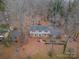 Two-story house viewed from above, surrounded by trees at 6800 April Ln, Charlotte, NC 28215