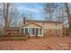 Two-story house with sunroom, deck, and fenced backyard at 6800 April Ln, Charlotte, NC 28215