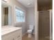 Clean bathroom with shower, toilet and vanity at 6800 April Ln, Charlotte, NC 28215