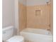 Clean bathroom with beige tile and tub shower at 6800 April Ln, Charlotte, NC 28215