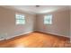 Bedroom with hardwood floors and neutral walls at 6800 April Ln, Charlotte, NC 28215