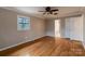 Hardwood floor bedroom with ensuite bathroom access at 6800 April Ln, Charlotte, NC 28215