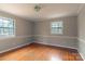 Spacious bedroom with hardwood floors and neutral walls at 6800 April Ln, Charlotte, NC 28215