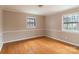 Bedroom with hardwood floors and neutral walls at 6800 April Ln, Charlotte, NC 28215