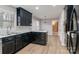 Kitchen with black cabinets and white countertops at 6800 April Ln, Charlotte, NC 28215