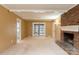 Living room with brick fireplace and access to a sunroom at 6800 April Ln, Charlotte, NC 28215