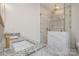 Bathroom with a walk-in shower, granite countertop, and modern gold fixtures at 828 Cabaniss Dr, Shelby, NC 28150