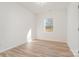 Bright bedroom with wood-look floors and a window offering natural light at 828 Cabaniss Dr, Shelby, NC 28150
