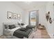 Virtually staged bedroom with two twin beds, nightstands, and a window at 828 Cabaniss Dr, Shelby, NC 28150
