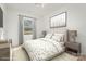 Virtually staged bedroom with two twin beds, nightstands, and window at 828 Cabaniss Dr, Shelby, NC 28150