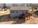 Rear view of a house showcasing a deck and backyard at 828 Cabaniss Dr, Shelby, NC 28150