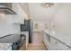 Modern kitchen with white cabinets, granite countertops, and stainless steel appliances at 828 Cabaniss Dr, Shelby, NC 28150