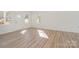 Bright living room with hardwood floors and an exterior door at 828 Cabaniss Dr, Shelby, NC 28150
