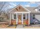 Front porch with wooden railings and a view of the yard at 828 Cabaniss Dr, Shelby, NC 28150
